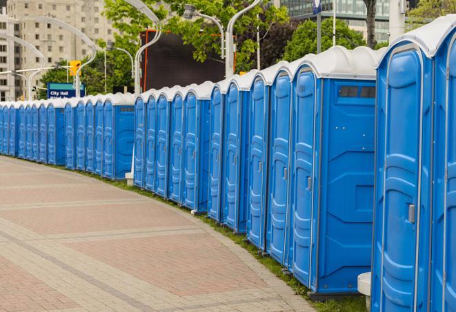 a row of portable restrooms at a fairground, offering visitors a clean and hassle-free experience in elmcreek